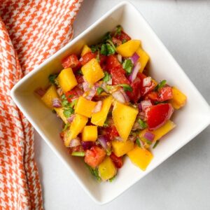 mango pico de gallo in white bowl