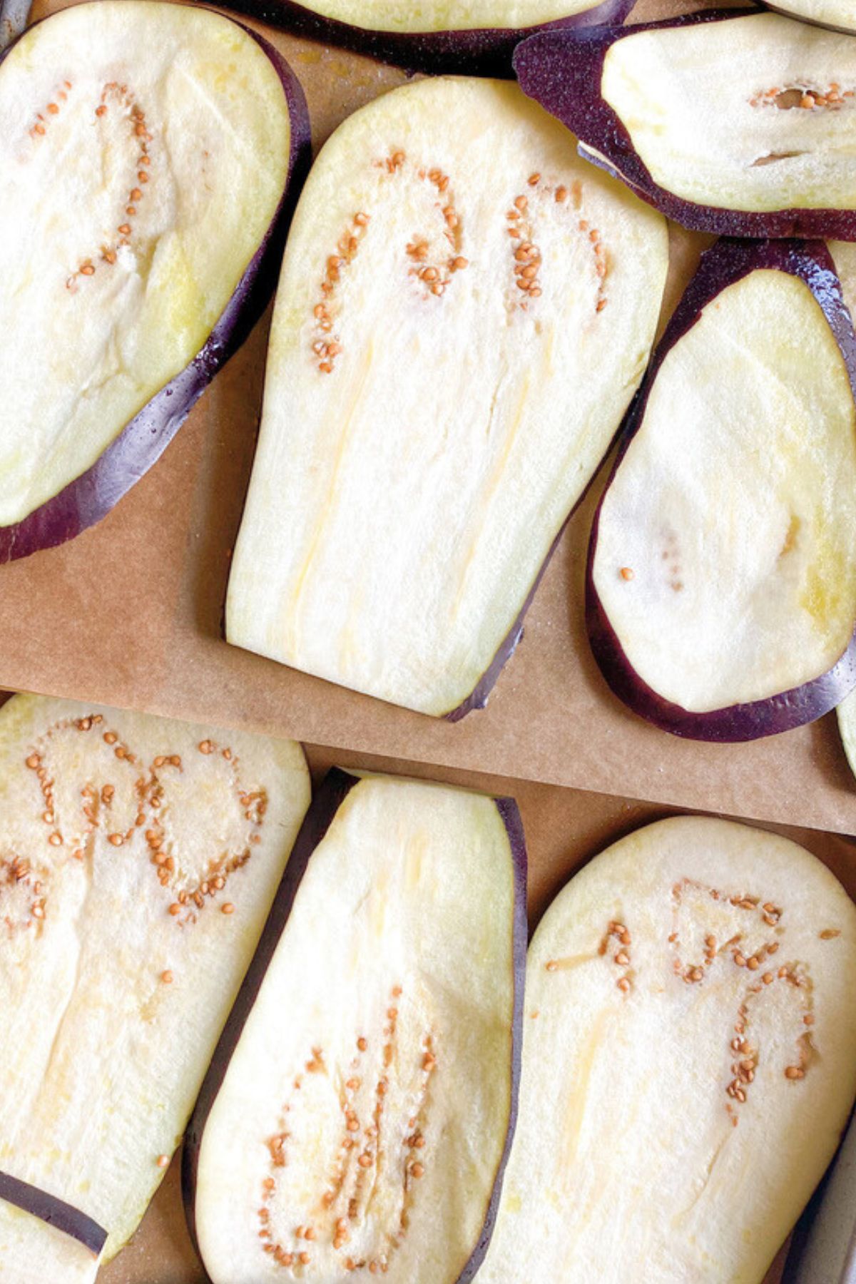 Eggplant on baking sheets with parchment paper.