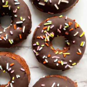 Baked Gluten Free Chocolate Donuts with sprinkles.