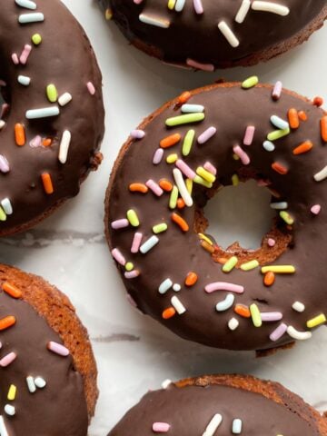 Baked Gluten Free Chocolate Donuts with sprinkles.