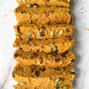 sliced pumpkin bread on marble plate