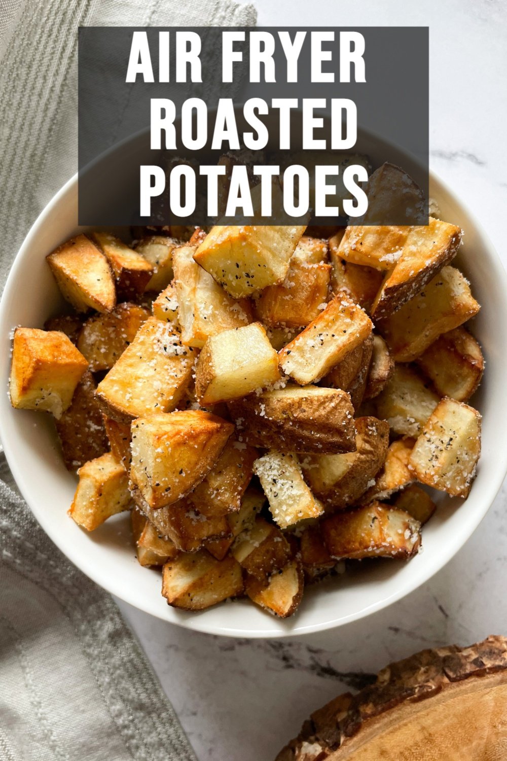 cooked potatoes in a white bowl with text overlay