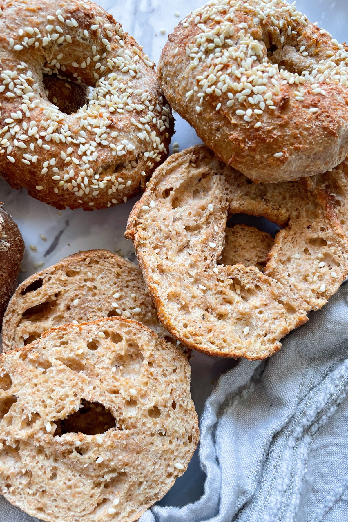 bagels on marble background and grey dish towel