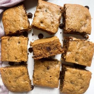 Almond Butter Banana Bread Bars on marble background with purple towel