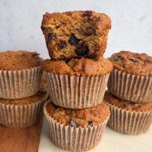 Almond flour banana muffins on a board.