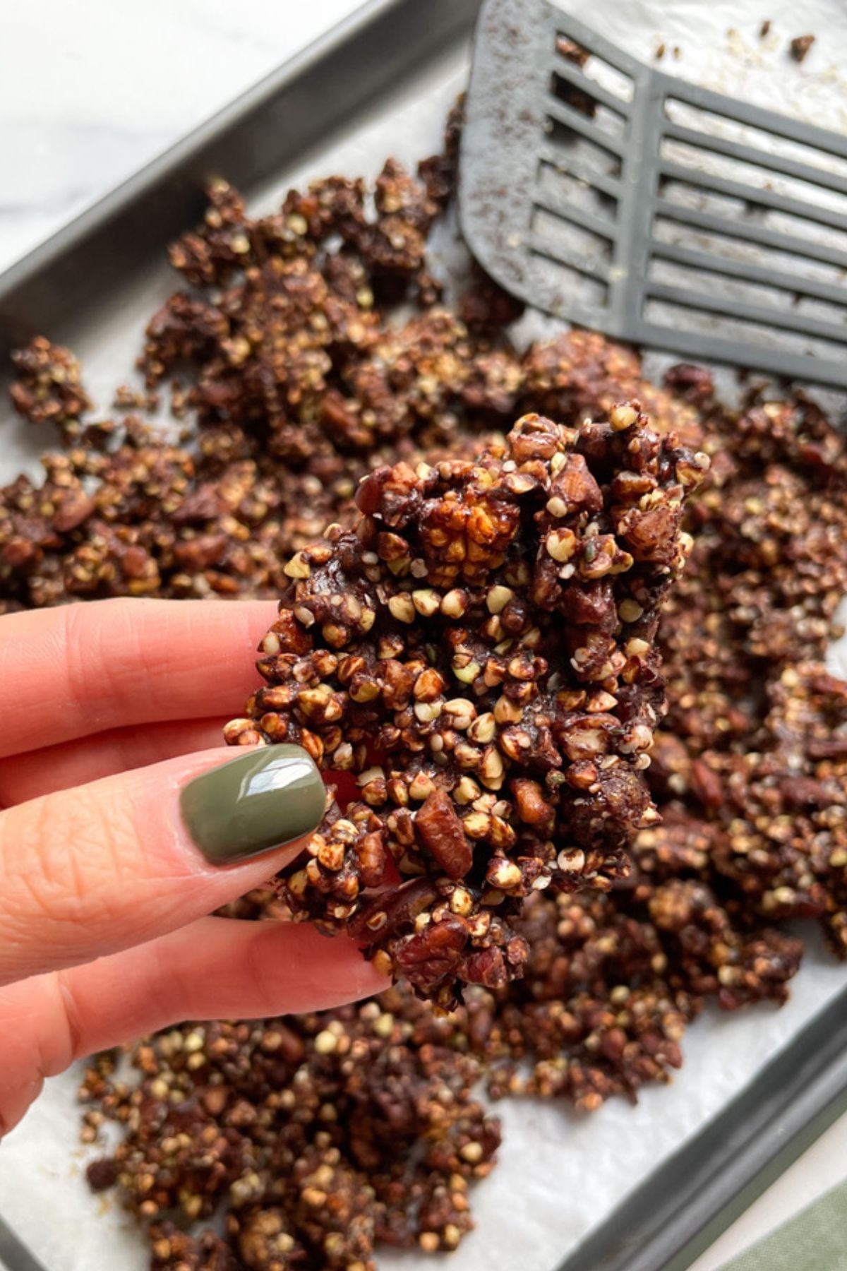 Cooked buckwheat granola on a baking sheet.
