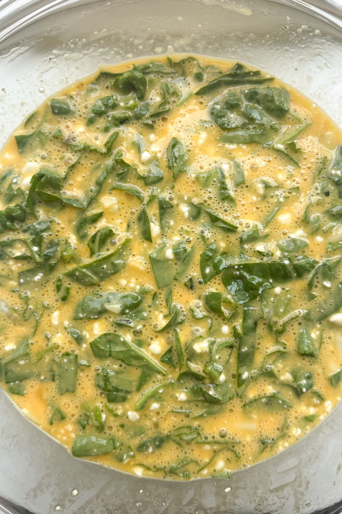 Eggs, cottage cheese and spinach in a bowl.