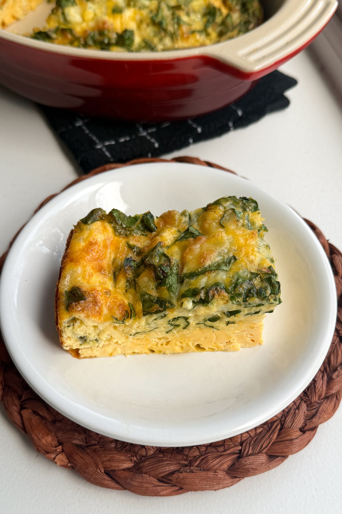 A slice of cottage cheese egg bake on a plate.